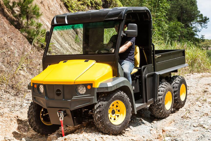 Six wheeled electric dump trucks through the mountains