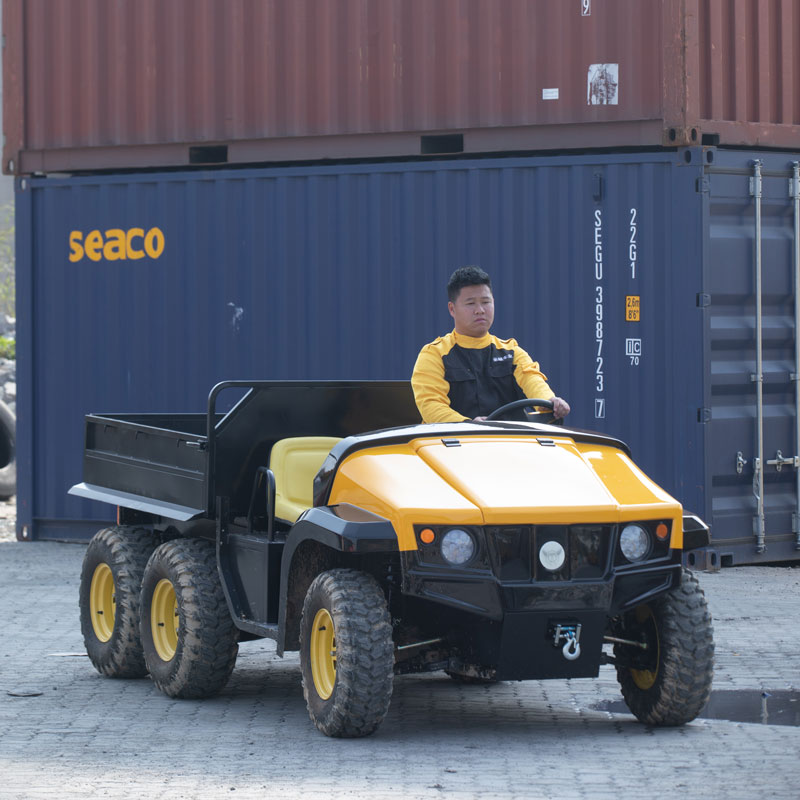 An electric utility vehicle headed to the dock waiting to be loaded